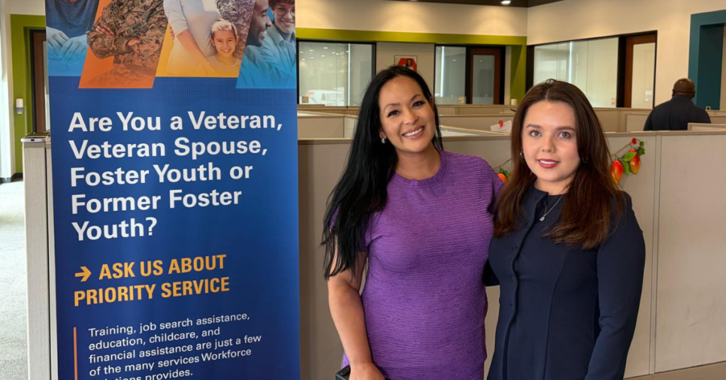 Dr. Maria Franco Cortes hugging a Univision correspondent at Workforce Solution offices after an interview.