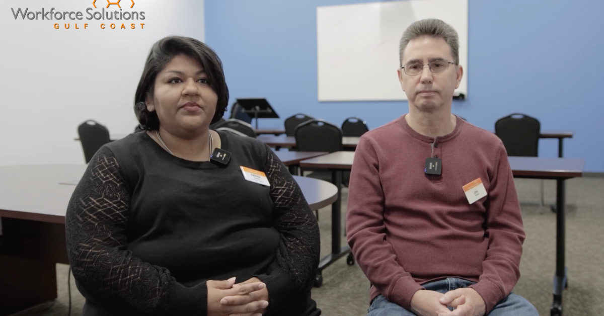 Jim Adams, Service Coordinator at the Conroe Workforce Solutions office and Career Adviser Nikita sit side by side in a conference room with blue walls.