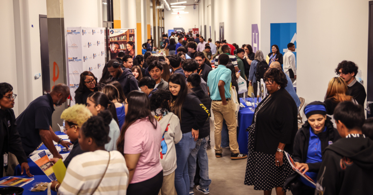 Youth Hiring event A hiring event filled with booths and young job seekers.