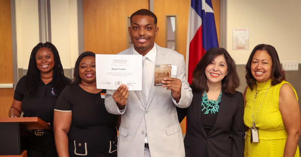 Bryce Turner, a Summer Earn & Learn (SEAL) intern, standing next to his mom, Juliet Stipeche and two other women.