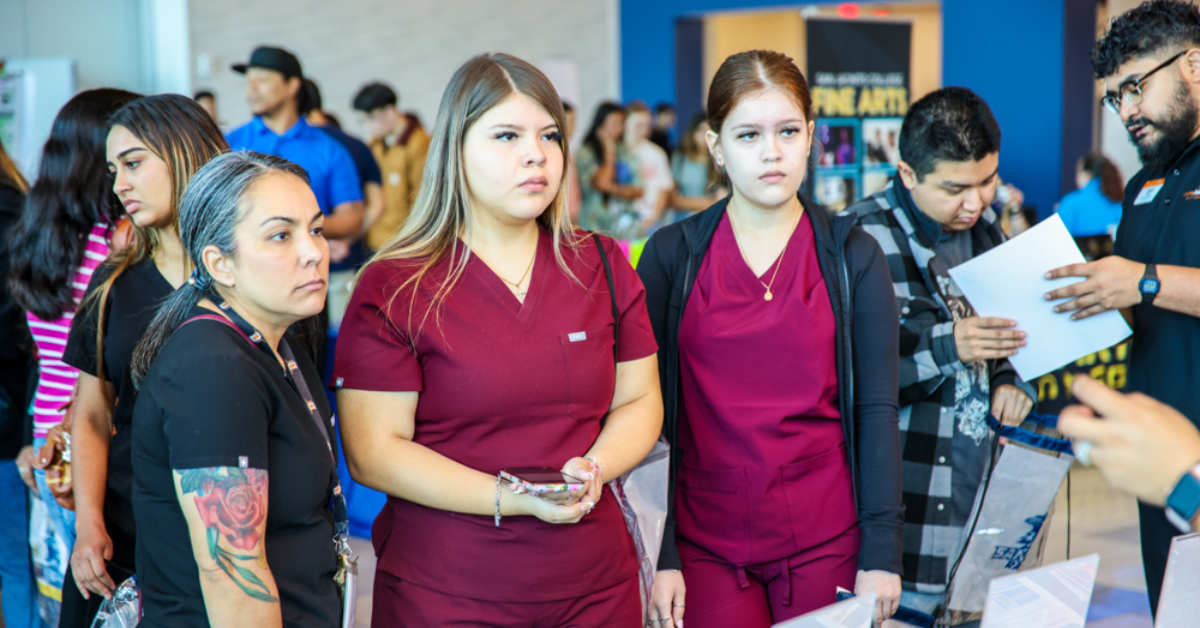 Students meet with a healthcare employer representative during a career exploration and workforce recruitment event.