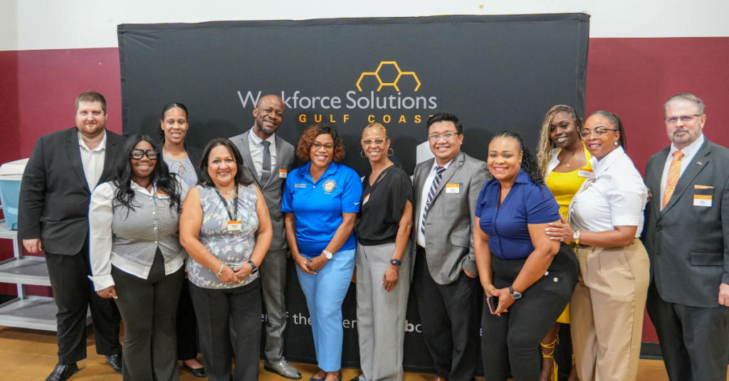 Workforce Solutions Gulf Coast staff and community partners posing together at the Be Successful Job Fair.
