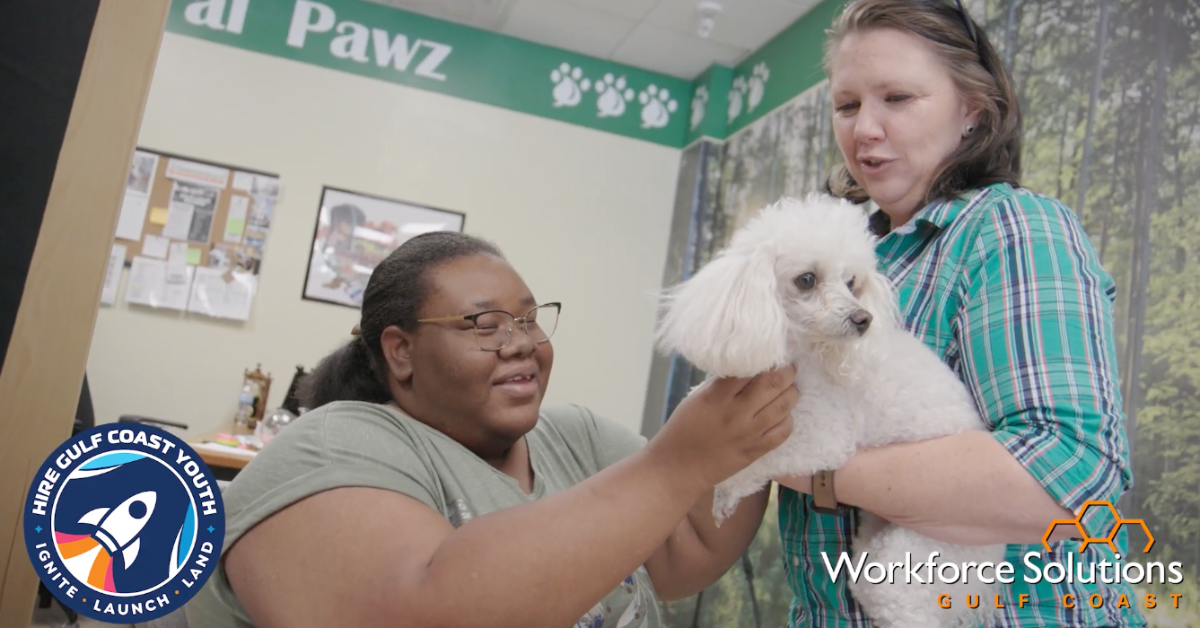 Summer Earn and Learn Participant Gains Hands-On Work Experience Summer Earn and Learn participant gaining hands-on experience working with a dog at a Gulf Coast worksite.