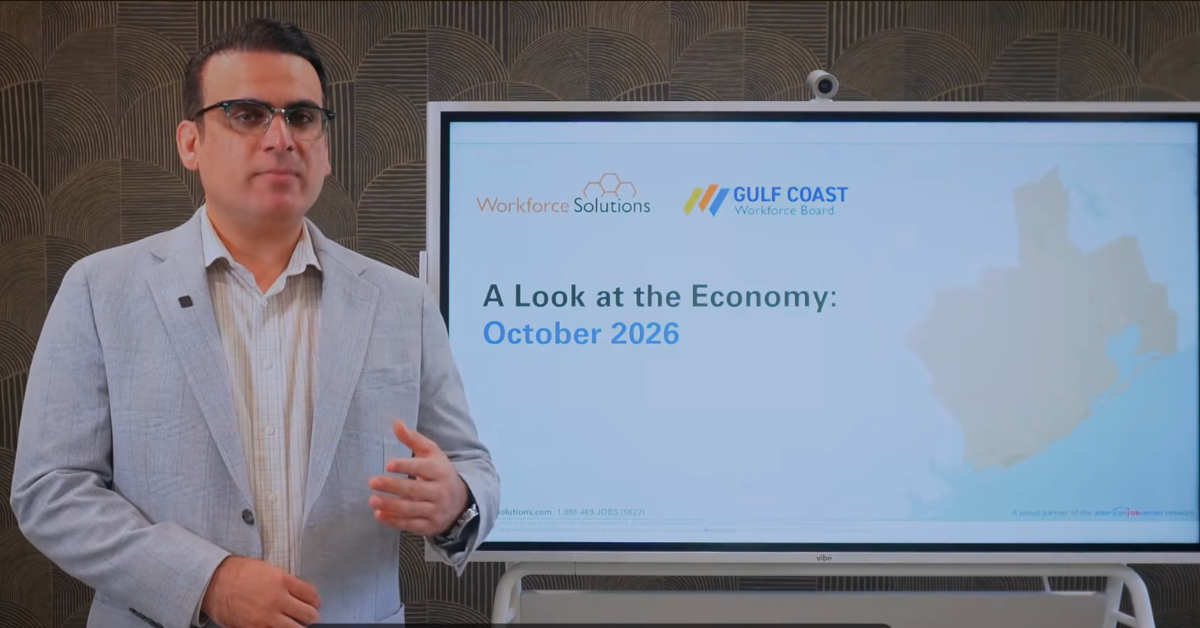 Gulf Coast Workforce Board economist Muhammad Emid Dizad presents the October 2026 edition of A Look at the Economy, standing beside a screen displaying the presentation title and Gulf Coast Workforce Board logo.