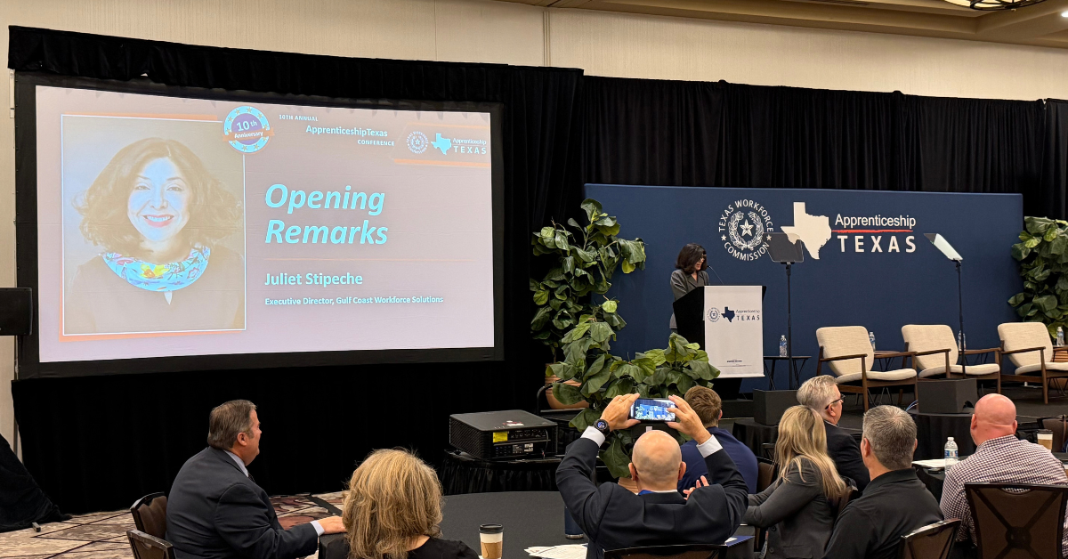 Juliet Stipeche Opens the 10th Annual ApprenticeshipTexas Conference Juliet Stipeche delivers opening remarks at the 10th Annual ApprenticeshipTexas Conference as attendees watch from the audience.